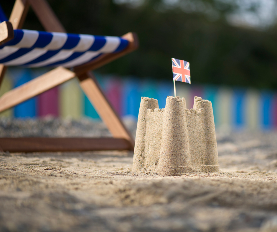 Small sandcastle with union jack flag